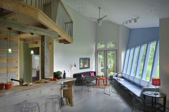 Split-level open plan living room and kitchen at home, Burlington, Vermont, USA
