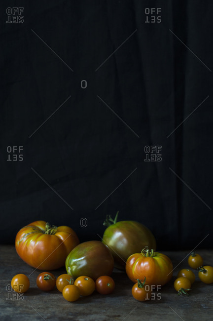 Assorted tomatoes with black background