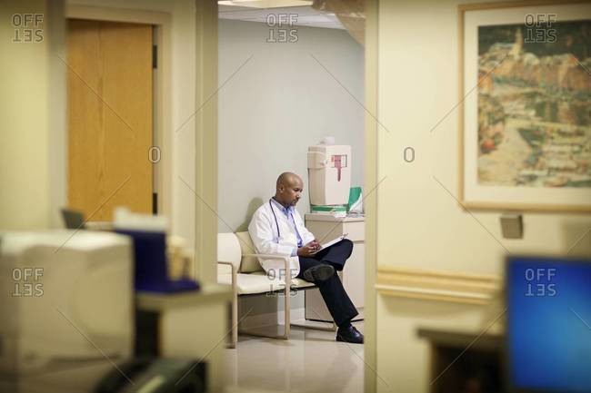 Doctor sitting in a waiting room in a hospital