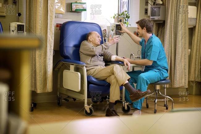 Elderly man receiving intravenous therapy