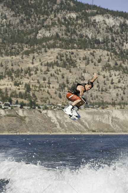 Man jumping high in the air on a wakeboard in Penticton, Canada