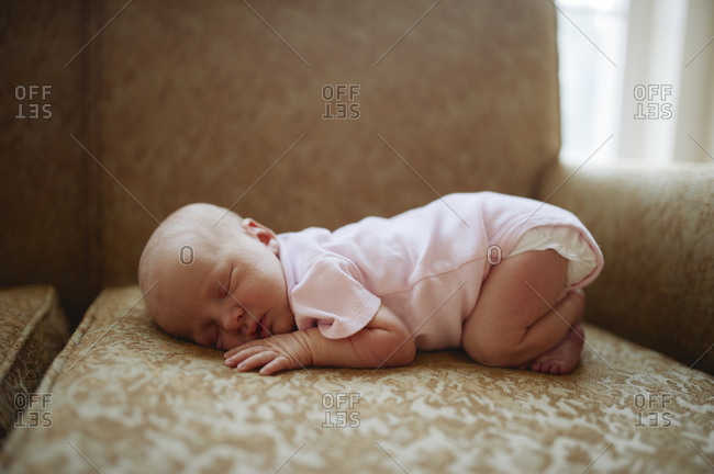 Newborn sleeping on the couch