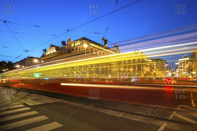Opera square with passing tramway at blue hour, Austria, Vienna
