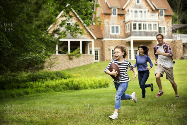 Family playing American football