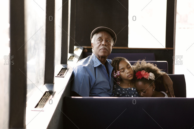 Grandfather and granddaughters on the East River ferry, New York