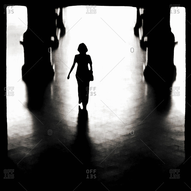 Silhouette of a woman passing through the corridors in Ho Chi Minh City, Vietnam