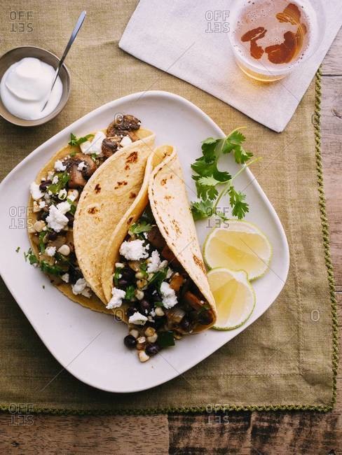 Tacos with mushroom, potato, corn, beans and queso fresco