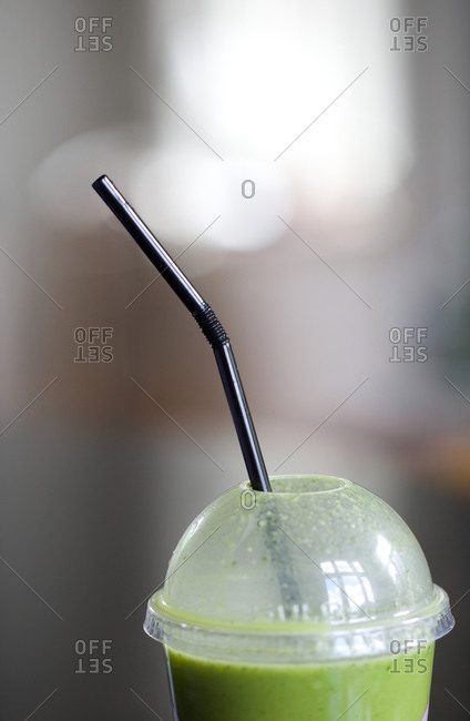 Glass of juice with straw