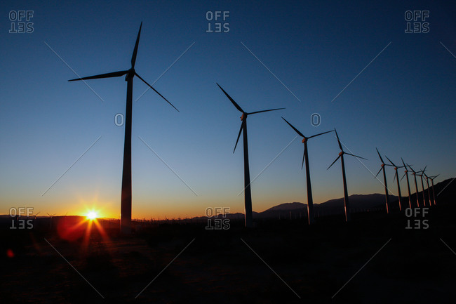 View of a wind farm at sunset
