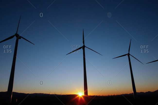 View of a wind farm at sunset