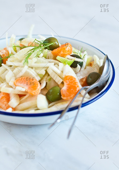 Fresh winter salad with fennel and orange served on a table