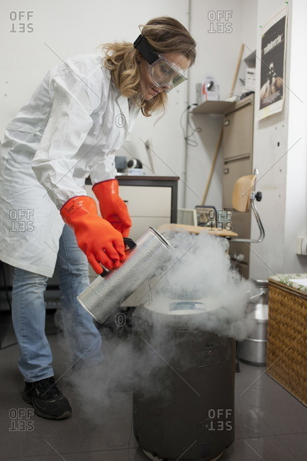 A chemical engineer pours liquid nitrogen at the chemical college of engineering