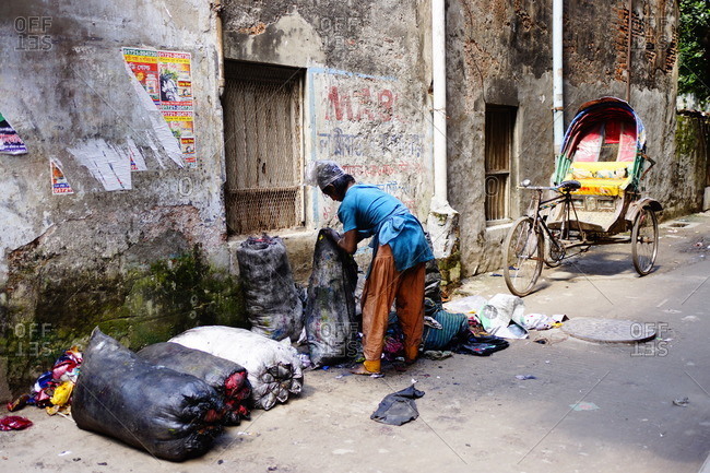 Man collecting garbage in Dhaka, Bangladesh