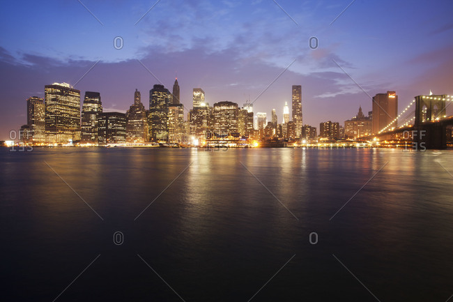 Lower Manhattan lighting up in the evening