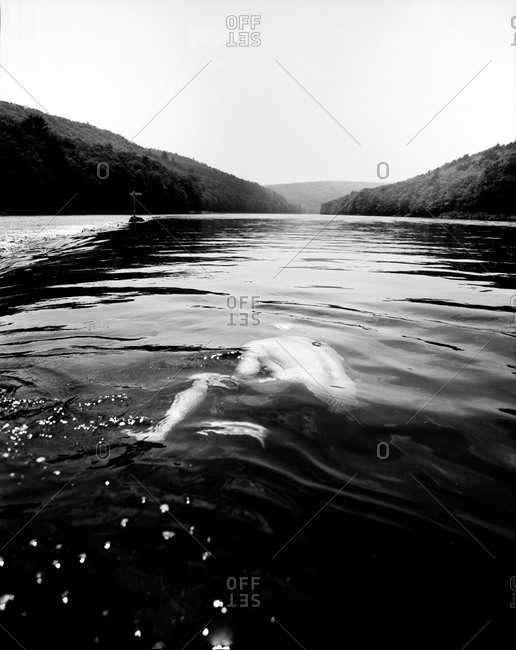 Man submerged in a river in Pond Eddy, New York