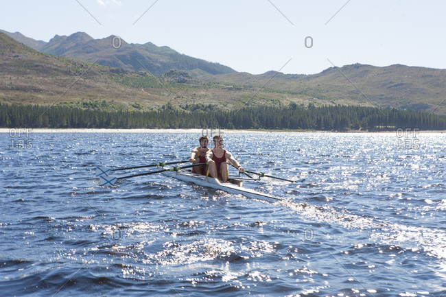 Double scull rowing boat in water