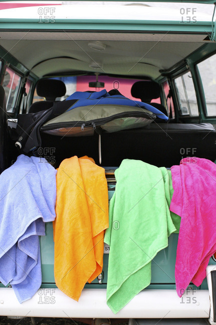 Towels drying in the back of a car