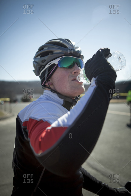 A cyclist rehydrates after competing in a race