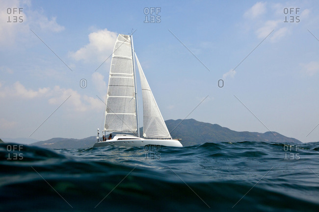 A luxury sailing boat on rough waters, Hong Kong