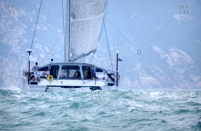 A luxury sailing boat on rough waters, Hong Kong