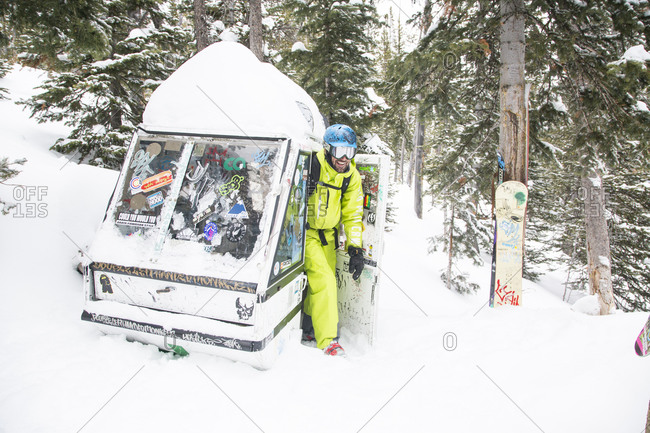 A male skier stops by a gondola fort at Big Sky Resort in Big Sky, Montana