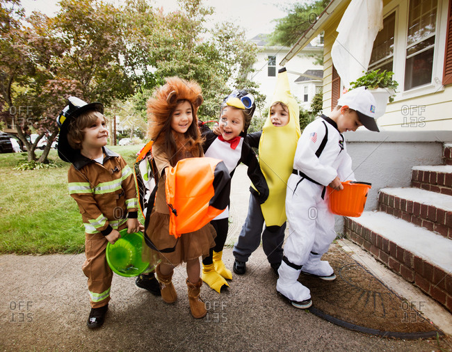 Group of kids outside house on Halloween