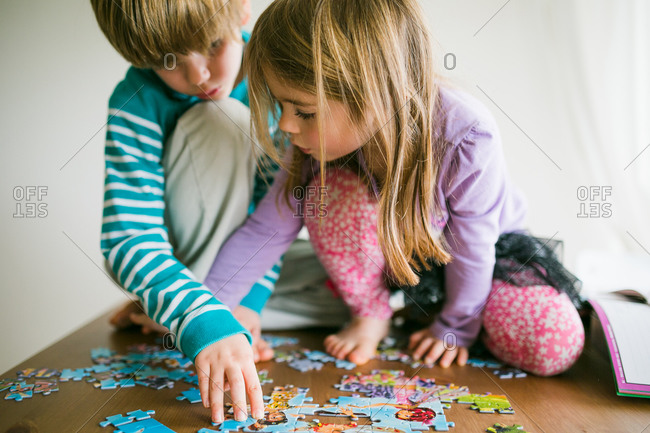 Children putting a jigsaw puzzle together