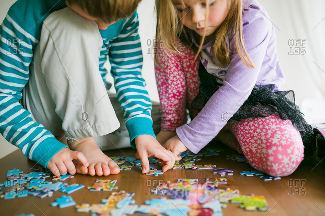 Kids playing with jigsaw puzzle