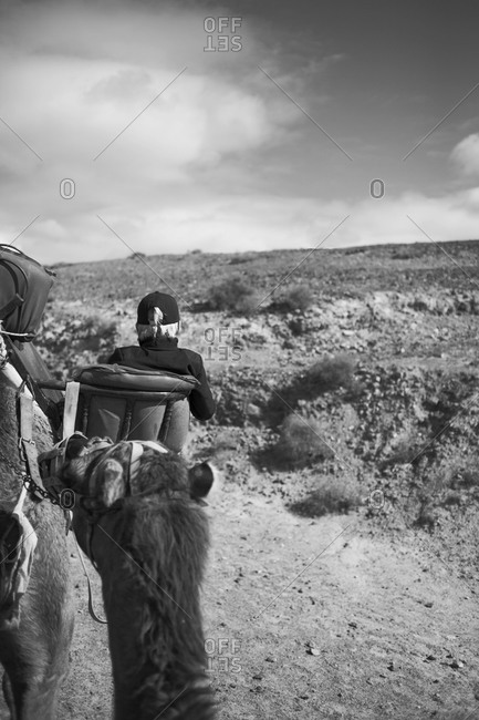 Woman riding on camel