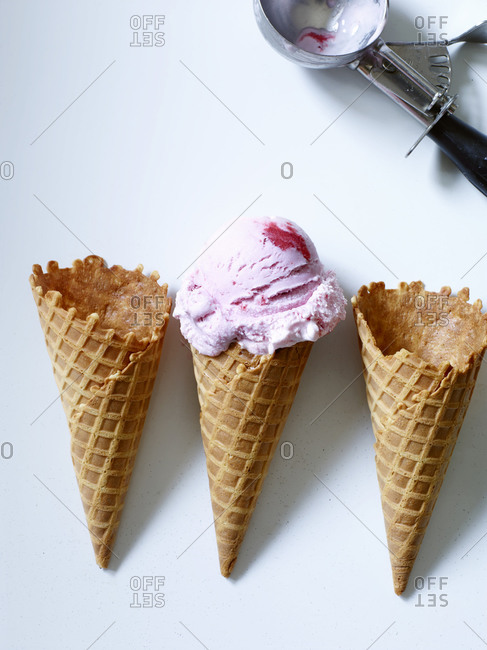 Strawberry ice cream waffle cones lined up