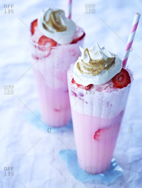 Two glasses of strawberry ice cream floats