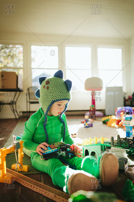 Boy playing in dinosaur costume