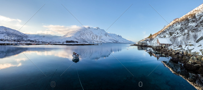 Boat Floating in the Middle of a Norwegian Fjord in a Winter Morning, Tromsø