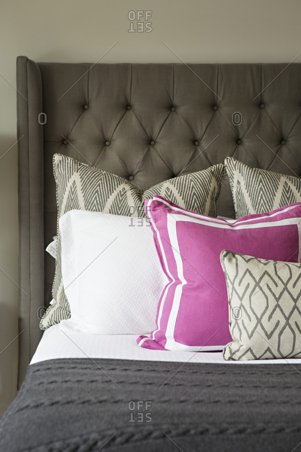 Throw pillows arranged on a bed
