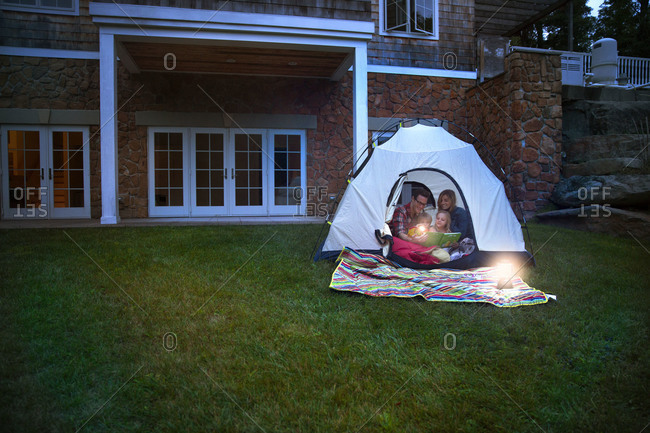 Family camping in the backyard