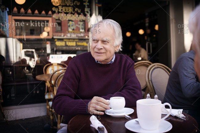 Portrait of senior man in a cafe