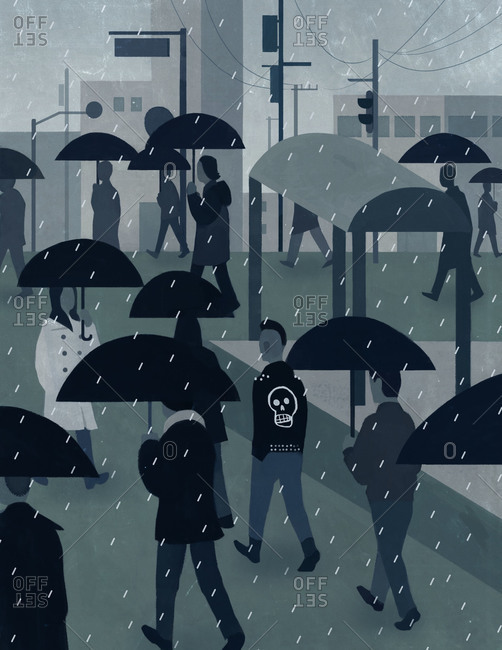 A crowd of people walk along a rainy city streets with umbrellas while a man in a punk rock jacket walks between them