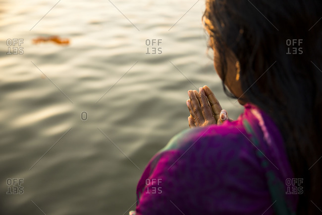 Woman praying in the Ganges, Varanasi, India
