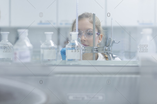 Young female scientist working in a pharmacy research laboratory