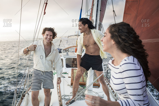Friends enjoy themselves on a sailboat