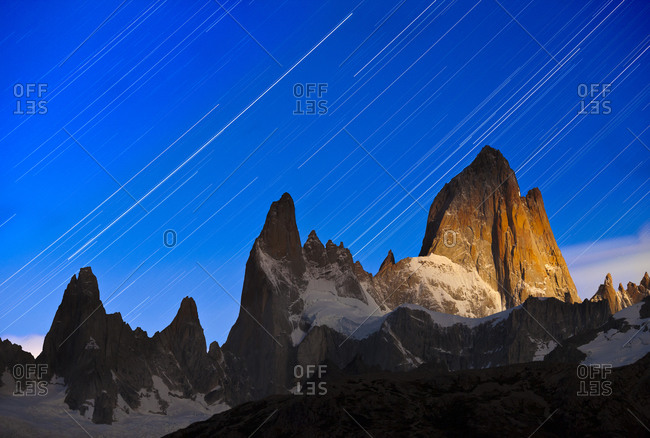 Star trails above a moonlit Mount Fitzroy in Argentina\'s Los Glaciers National Park