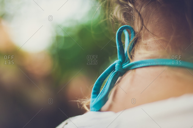 Close up of a bikini strap on a girl