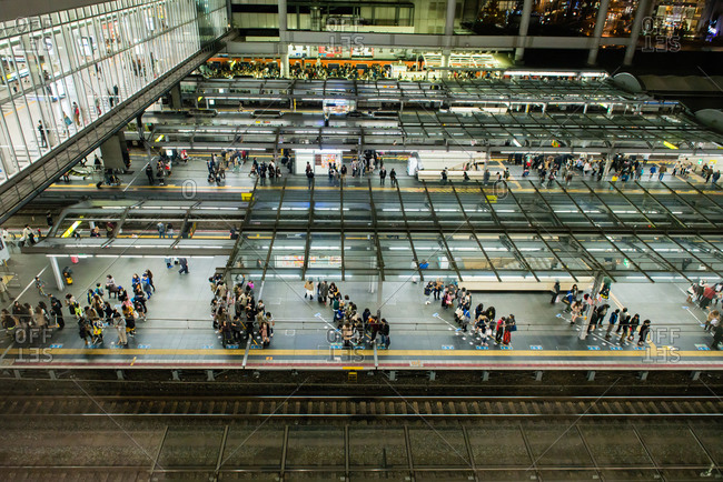 Passengers waiting in an orderly fashion on the platforms at Osaka Station, Osaka, Japan