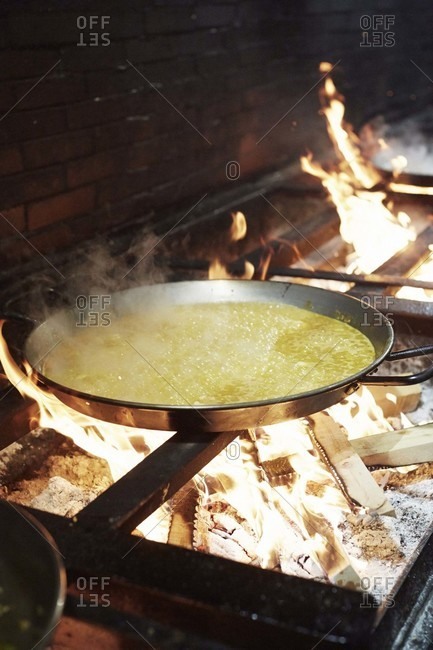 Paella being cooked at Casa Carmela restaurant in Valencia