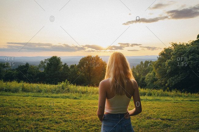 Back view of woman watching the sunset