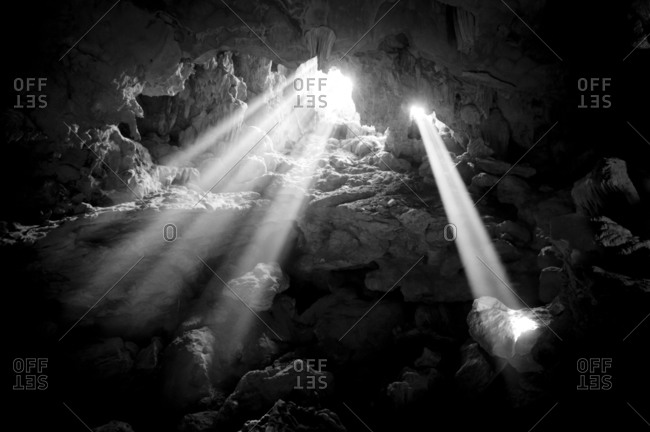Light rays shine into a cave in Vietnam, Asia
