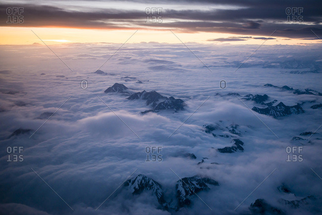 Mountains emerging from clouds in Alaska, USA