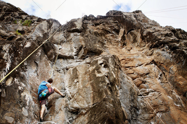 A rock climber scaling a rock face