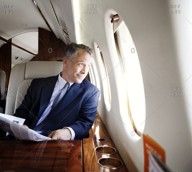 Businessman traveling on a private jet