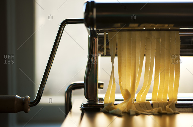 Handmade pasta in a pasta machine